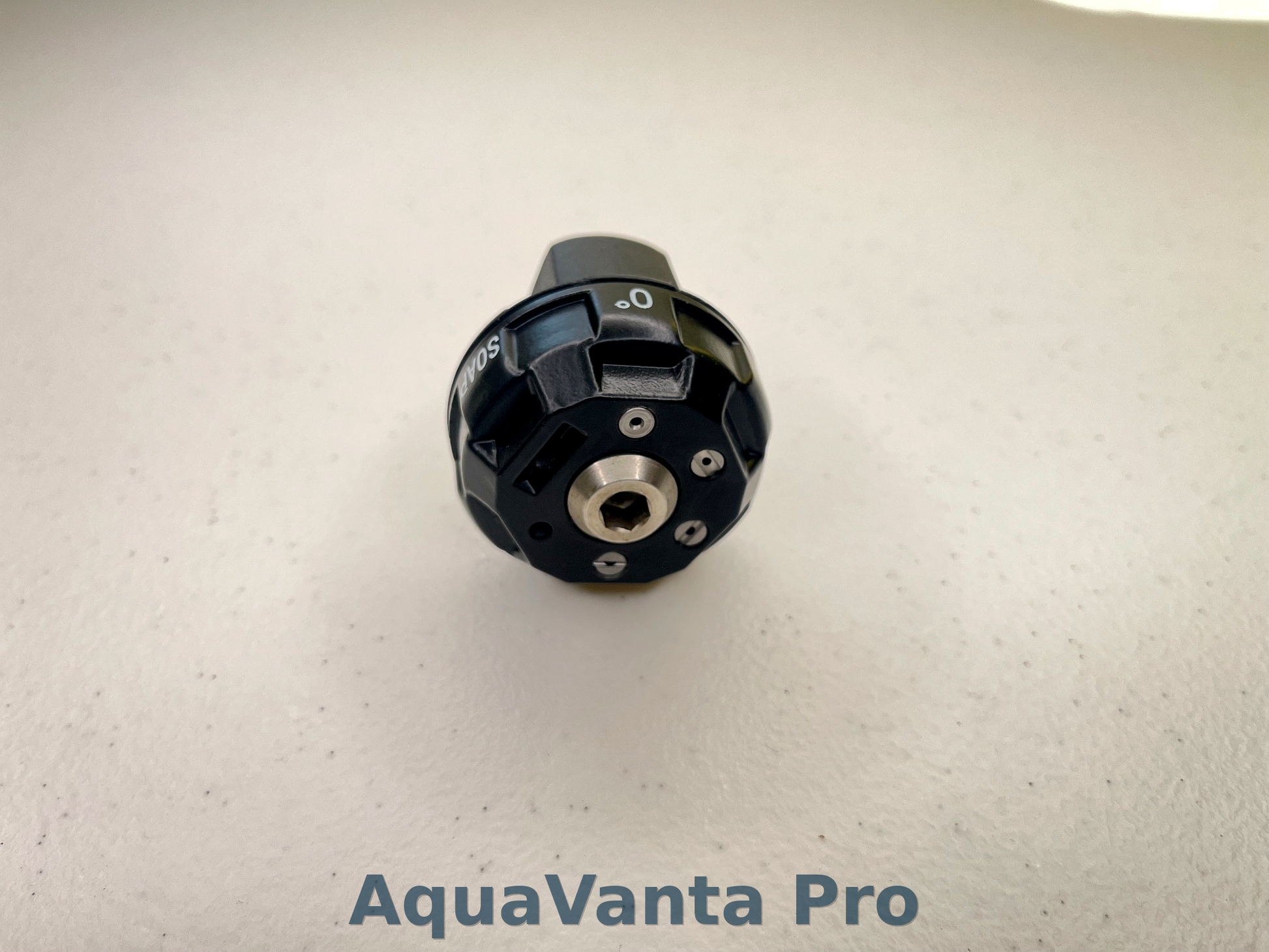 Black cylindrical device with 'AquaVanta Pro' branding on a light gray background