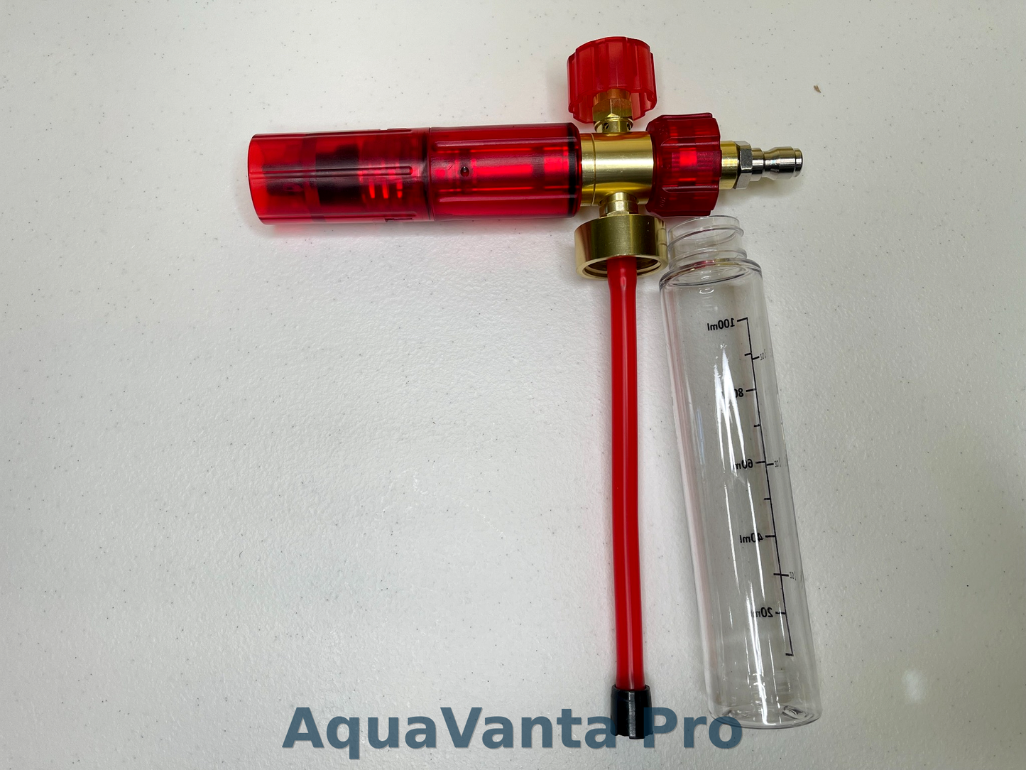 Red and brass.injector with a clear tube on a white background, branded 'AquaVanta Pro'.